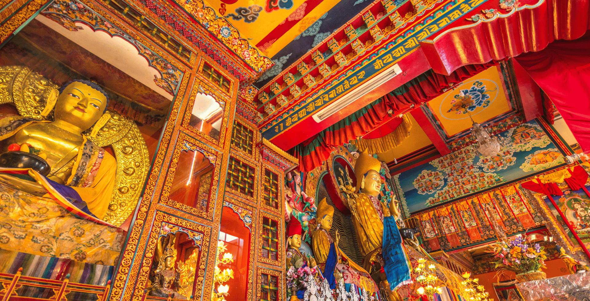 Inside Kopan Monastery, thangka and Buddha statues