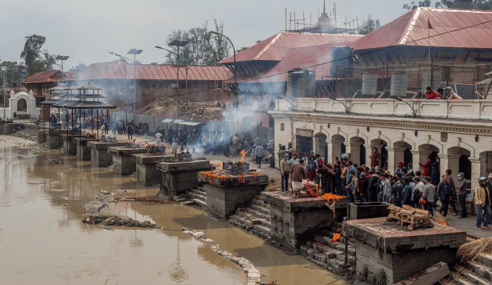 Multiple Open air cremations on Aarya Ghat besides Bagmati river