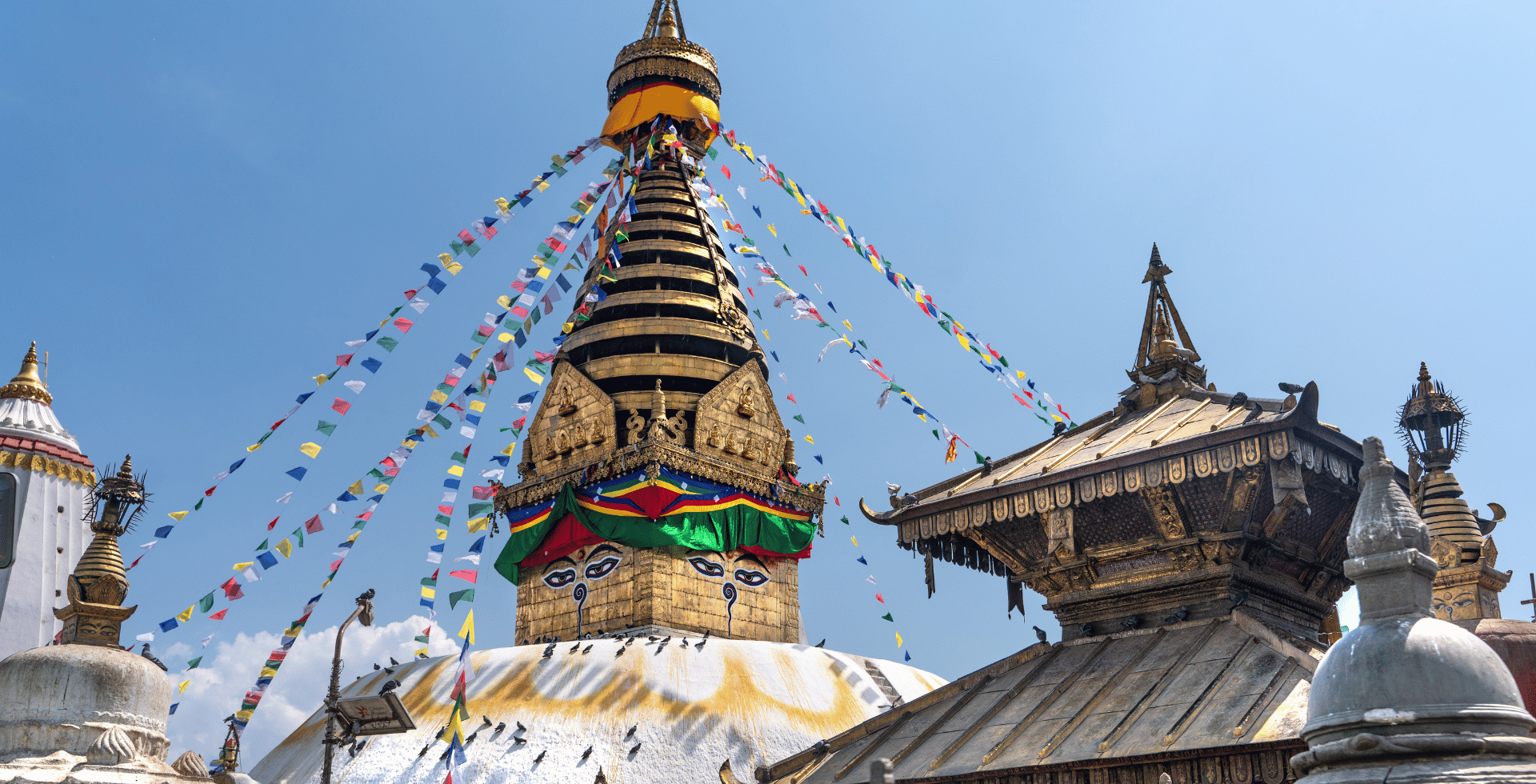 Swayambhu Stupa with small chaityas and Ajima Temple infront of it
