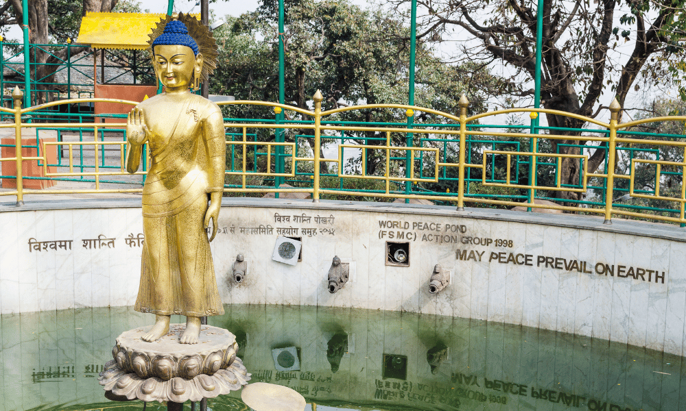 Statue of Buddha in World Peace Pond, Swayambhu